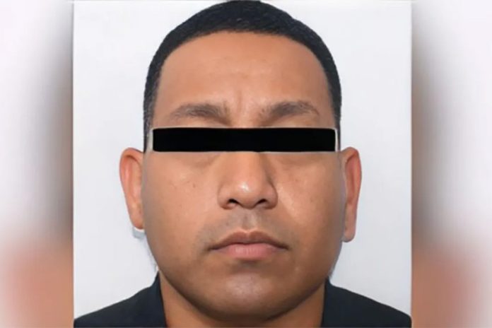 Police mugshot of Carlos Alberto Monsivais Trevino with a black rectangle over the image of his eyes in order to disguise his identity.