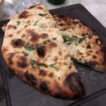 Cheese-stuffed naan bread, which can use queso Oaxaca