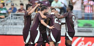 The Mexican men's soccer team hugs and celebrates after beating New Zealand