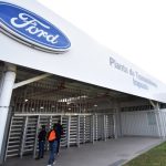 Ford manufacturing plant entrance in Irapuato, showing the Ford logo and a sign saying Planta de Transmissiones Irapuato.