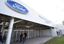 Ford manufacturing plant entrance in Irapuato, showing the Ford logo and a sign saying Planta de Transmissiones Irapuato.