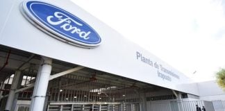 Ford manufacturing plant entrance in Irapuato, showing the Ford logo and a sign saying Planta de Transmissiones Irapuato.