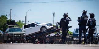 Sinaloa state police impound a white SUV