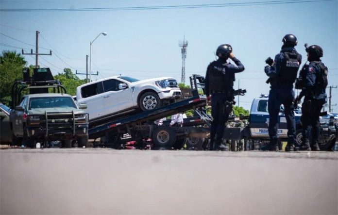 Sinaloa state police impound a white SUV