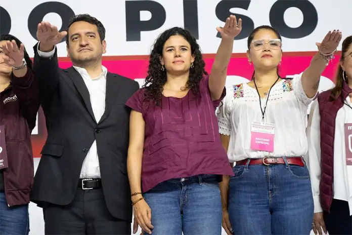 Luisa María Alcalde salutes at her swearing-in as Morena's new party leader