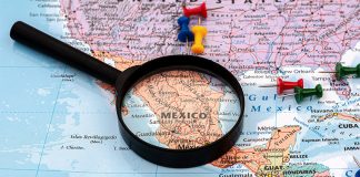 A map with a magnifying glass over Mexico