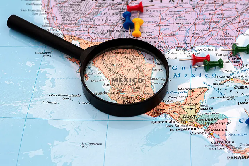 A map with a magnifying glass over Mexico