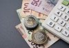 Mexican peso bills, coins and a calculator