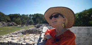 Older foreign woman enjoying life in an archeological site in Mexico.