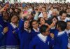 Sheinbaum with school children during an event to announce the scholarship