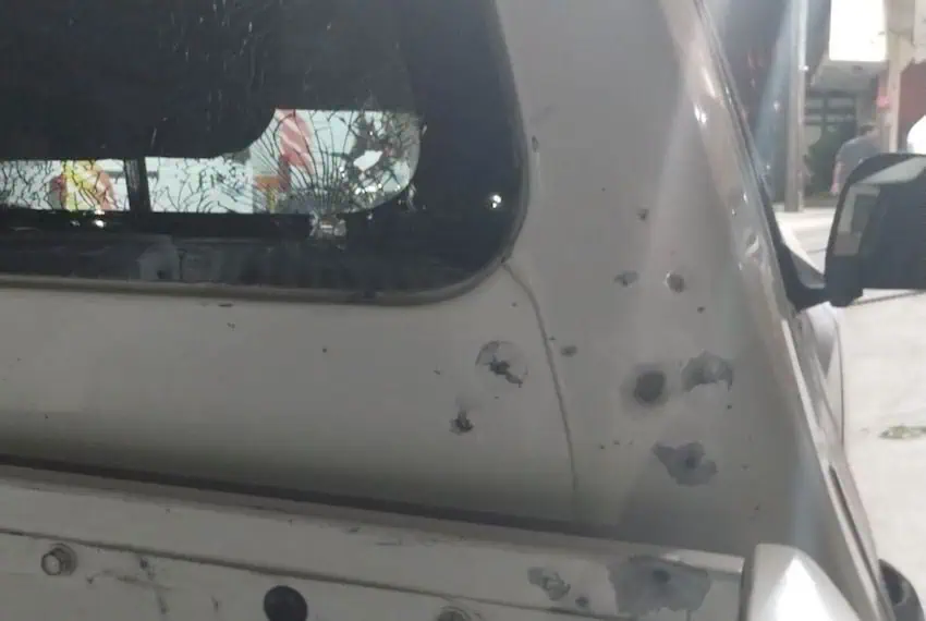 A car riddled with bullet holes