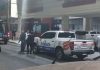 Police stand in front of the El Debate headquarters in Culiacán, Sinaloa