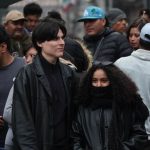 Two people wearing heavy winter clothes