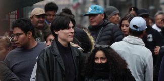 Two people wearing heavy winter clothes