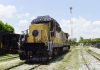 Yellow railroad locomotive engine car on a railroad track