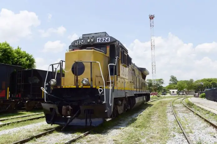 Yellow railroad locomotive engine car on a railroad track