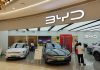 BYD showroom with cars on display and people shopping