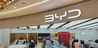 BYD showroom with cars on display and people shopping