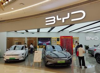 BYD showroom with cars on display and people shopping