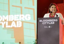 Clara Brugada behind a podium at Bloomberg CityLab 2024 in Mexico City, in the middle of a speech.