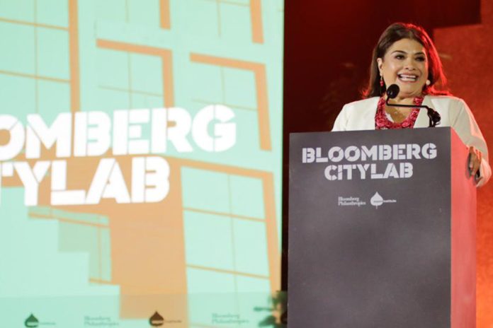 Clara Brugada behind a podium at Bloomberg CityLab 2024 in Mexico City, in the middle of a speech.