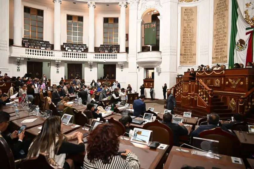 Mexico City's legislature in session from behind seated members.