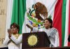 Mexico City Mayor Clara Brugada salutes the flag as she is sworn in as mayor