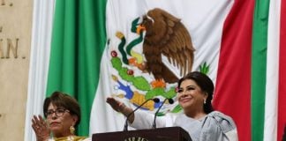 Mexico City Mayor Clara Brugada salutes the flag as she is sworn in as mayor
