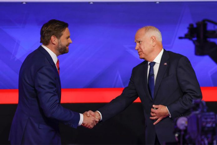 JD Vance and Tim Walz at the vice presidential debate shaking hands before they begin