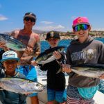 A family out tuna fishing in Cabo San Lucas