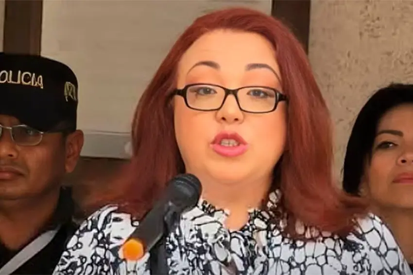 Mexican Judge Nancy Juarez Salas speaking into a microphone at a press conference