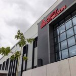 The entrance to Avery Dennison's new plant in Querétaro, showing the company name in red letters