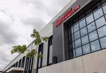 The entrance to Avery Dennison's new plant in Querétaro, showing the company name in red letters