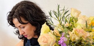 A woman at a flower arranging class in Mexico City