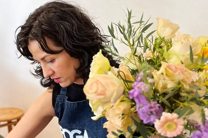 A woman at a flower arranging class in Mexico City