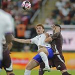 Mexican player disputes a ball with the American opponent.