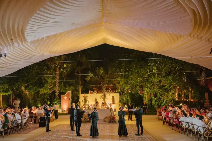 Mariachis serenade bride and groom at a wedding. Mexican wedding traditions