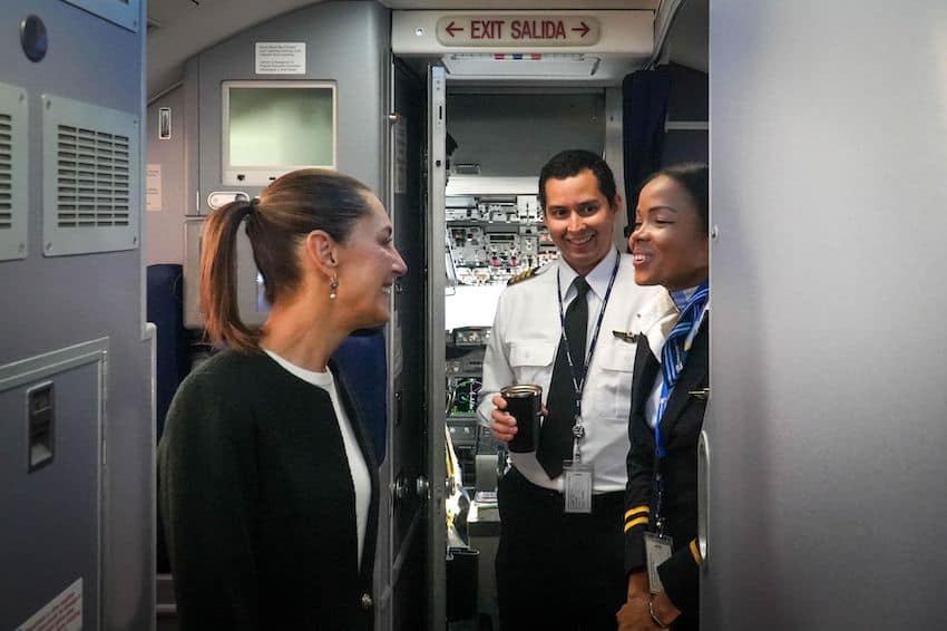 President Sheinbaum greets the pilot and steward as she boards a commercial flight to the G20 summit in Rio.