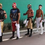 A group of traditional luchadores, ready to compete in Lucha por el Barrio tournament.