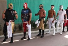 A group of traditional luchadores, ready to compete in Lucha por el Barrio tournament.