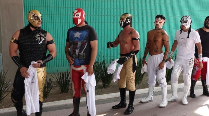 A group of traditional luchadores, ready to compete in Lucha por el Barrio tournament.