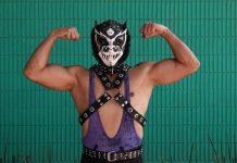 A traditional Mexican luchador poses for the camera.