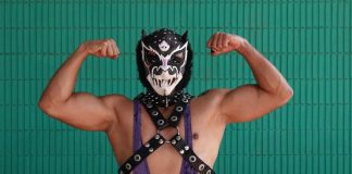 A traditional Mexican luchador poses for the camera.