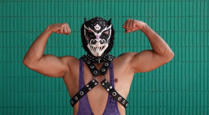 A traditional Mexican luchador poses for the camera.