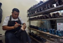 A Mexican shoe-maker at work