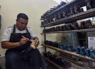 A Mexican shoe-maker at work