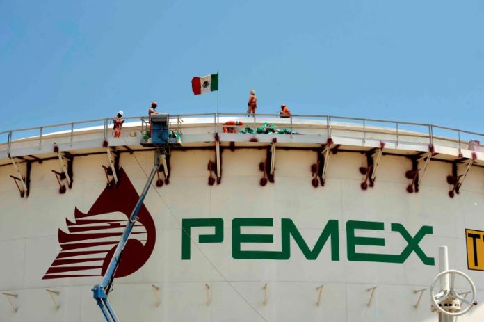 A Pemex storage facility with a Mexican flag