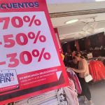 A poster advertises discounts of 30% to 70% in a clothing store for Buen Fin 2024