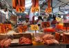 A carnicería displays meat cuts and prices