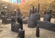 The old wooden posts of an pre-Columbian dock are visible in the hole of an archeological dig in Mexico City's Chapultepec Park